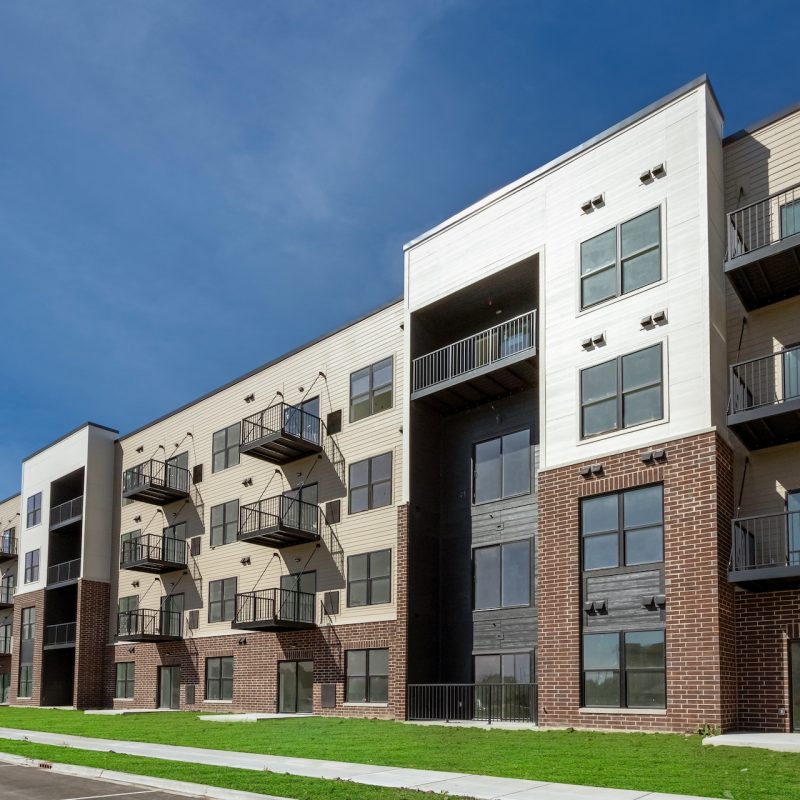 Station 250 apartment building entrance area with modern architectural details and mixed materials in Mundelein IL