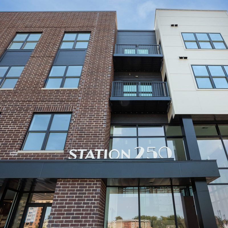 Station 250 building close-up showing contemporary design elements, windows, and exterior materials in Mundelein IL"