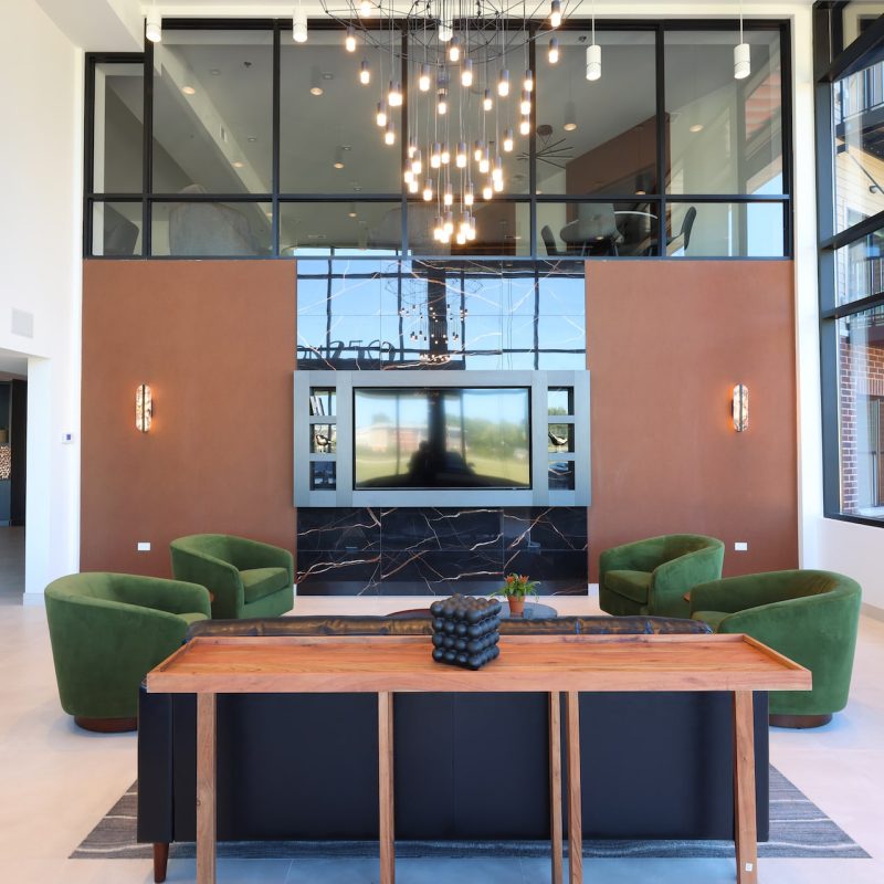 Station 250 co-working lounge with modern furniture, pendant lighting, and collaborative workspace design Mundelein IL