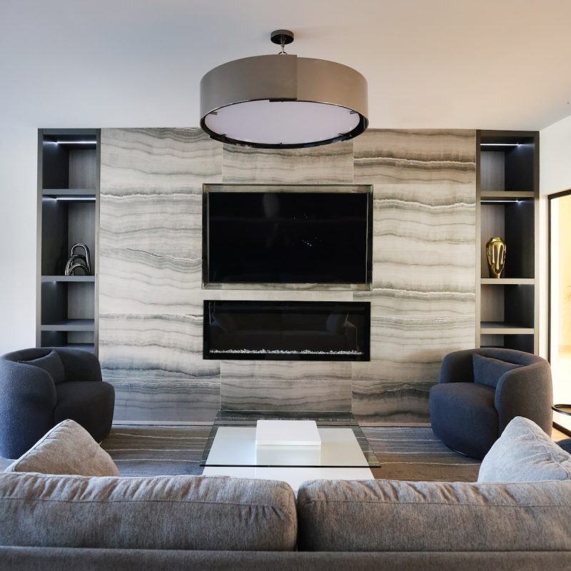 Station 250 cozy seating area with modern fireplace, comfortable chairs, and warm ambient lighting Mundelein IL