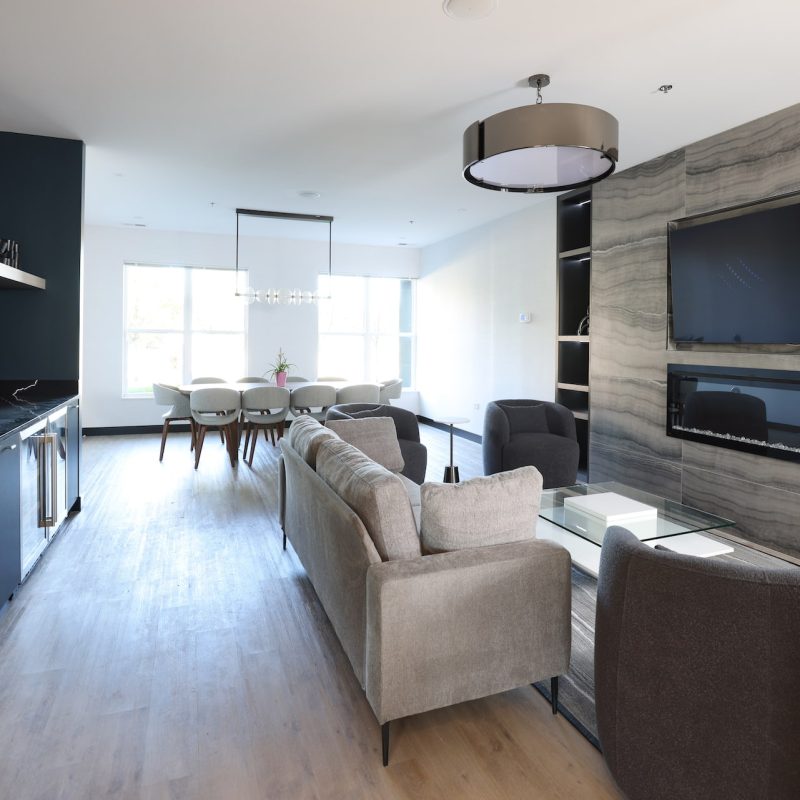 Station 250 open-concept community area with modern furniture, large windows, and contemporary design Mundelein IL