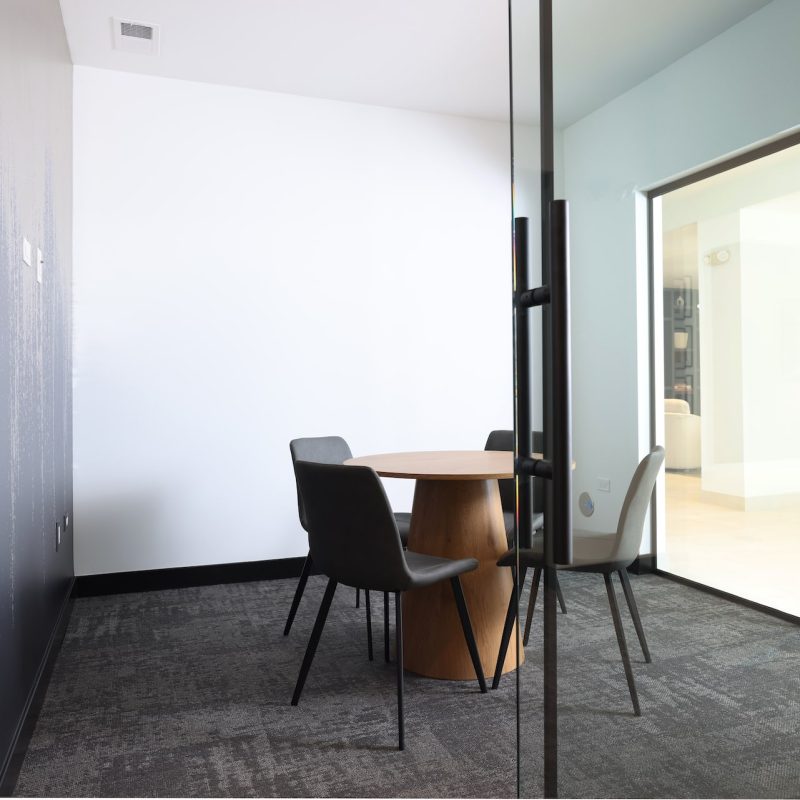 Station 250 conference room with modern table, ergonomic chairs, and professional meeting setup Mundelein IL