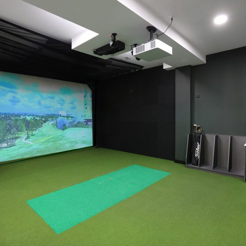Station 250 indoor golf simulator room with projection screen and professional golf equipment Mundelein IL"