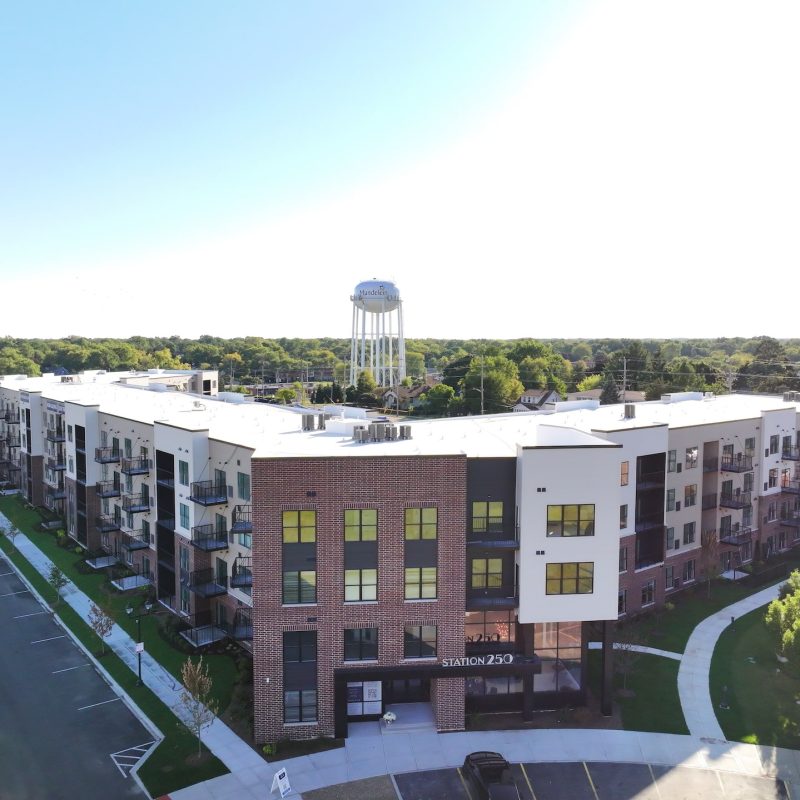 Station 250 apartment buildings surrounding central courtyard area with contemporary design in Mundelein IL